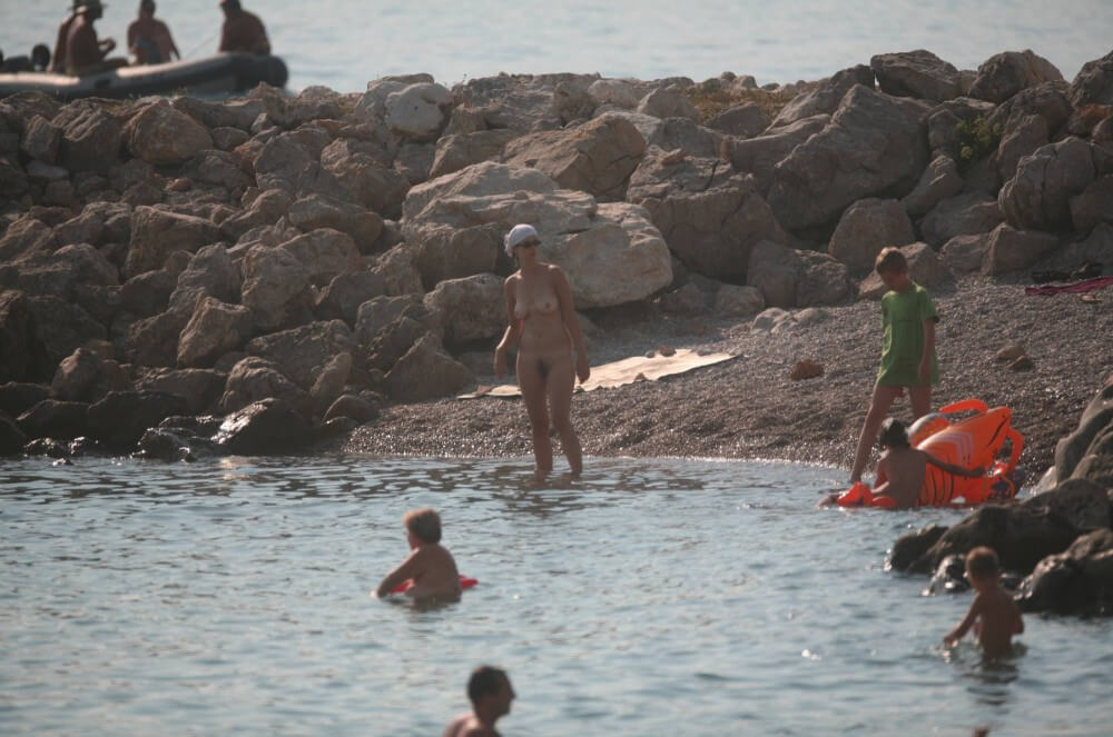 FKK cove pyramid in waters - Types of recreation in nudist and naturist resorts and parks