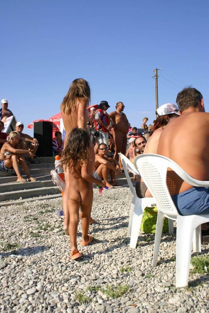 Naturist Standing Sideline - Nudity is perceived as a natural expression of life