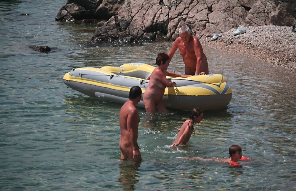 Lone Nudist in Yellow Boat photos - The naked body is an expression of beauty