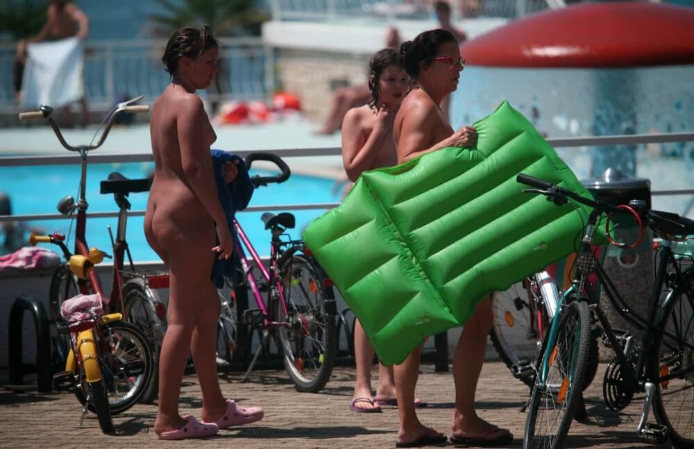 Outdoor Pool Sideliners pics - Naturists value harmony with nature and a simple way of life