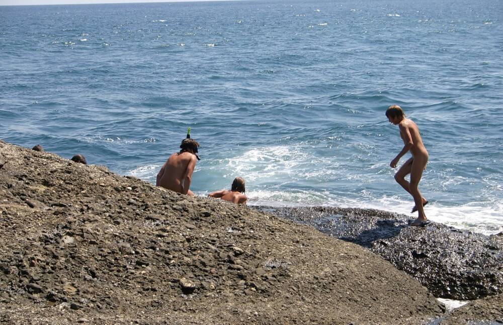 Leaning Against Hit Rocks pics - Undressing is permissible only within ones own community
